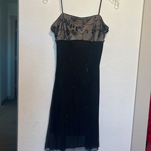 This is a gorgeous spaghetti strap Cache Dress